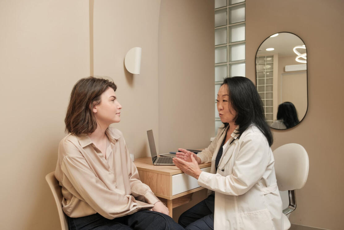 Pharamacist talking to her patient